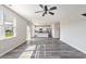 Bright and airy living room with hardwood floors flowing into an open-concept kitchen and dining area at 2989 Skylar Dr., Myrtle Beach, SC 29577