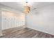 Open-concept living room area with hardwood floors, neutral walls, and modern light fixture at 2989 Skylar Dr., Myrtle Beach, SC 29577