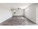 Bright living room with gray wood flooring, neutral walls, and a ceiling fan at 2989 Skylar Dr., Myrtle Beach, SC 29577