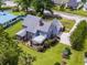 An aerial perspective of a lovely home and yard, complete with pool, screened porch and deck at 302 Sunnehanna Dr., Myrtle Beach, SC 29588