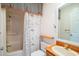 Full bathroom featuring a framed mirror, wood vanity, and shower tub combination at 302 Sunnehanna Dr., Myrtle Beach, SC 29588