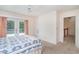 Bright bedroom featuring French doors, neutral walls, and a carpeted floor at 302 Sunnehanna Dr., Myrtle Beach, SC 29588