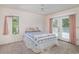 Bright bedroom featuring a ceiling fan, windows, and French doors leading to the exterior at 302 Sunnehanna Dr., Myrtle Beach, SC 29588