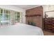 Bedroom featuring a brick fireplace, a sliding glass door to the outside and dark furniture at 302 Sunnehanna Dr., Myrtle Beach, SC 29588