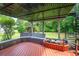 Deck with seating and decorative planters overlooks the landscaped backyard at 302 Sunnehanna Dr., Myrtle Beach, SC 29588