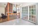 Bright dining area featuring tile floors, a chandelier, and sliding glass doors to the deck at 302 Sunnehanna Dr., Myrtle Beach, SC 29588
