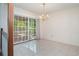 Dining room with sliding doors to the outdoor deck and a decorative chandelier at 302 Sunnehanna Dr., Myrtle Beach, SC 29588