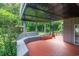 Exterior deck with seating underneath and black spiral staircase at 302 Sunnehanna Dr., Myrtle Beach, SC 29588