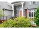 Charming home with a front porch, stately columns, a decorative fence, and tidy landscaping at 302 Sunnehanna Dr., Myrtle Beach, SC 29588