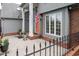 Charming home with a covered porch and decorative fence at 302 Sunnehanna Dr., Myrtle Beach, SC 29588