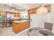 Well-lit kitchen with stainless steel appliances, granite counters, and a breakfast nook at 302 Sunnehanna Dr., Myrtle Beach, SC 29588
