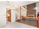 Open concept living room next to the kitchen with a brick fireplace at 302 Sunnehanna Dr., Myrtle Beach, SC 29588