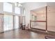 Bright living room with large windows, hardwood floors and a staircase at 302 Sunnehanna Dr., Myrtle Beach, SC 29588