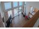 Overhead view of the living room featuring hardwood floors, floor to ceiling windows, and floral curtains at 302 Sunnehanna Dr., Myrtle Beach, SC 29588