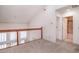 Loft area with carpet flooring, a view of the windows, and an open doorway to the bathroom at 302 Sunnehanna Dr., Myrtle Beach, SC 29588
