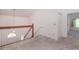 Carpeted loft area with wooden railing overlooking the downstairs area and doorways at 302 Sunnehanna Dr., Myrtle Beach, SC 29588