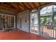 Cozy screened porch featuring a ceiling fan, chandelier, and painted wood floor at 302 Sunnehanna Dr., Myrtle Beach, SC 29588