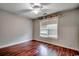 Cozy bedroom with beautiful wood floors and a ceiling fan for added comfort at 303 Ayrie Ct., Conway, SC 29527