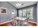 Bright dining area with hardwood floors and natural light from large windows at 303 Ayrie Ct., Conway, SC 29527