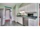 Traditional kitchen offers stainless steel appliances and tiled floors at 303 Ayrie Ct., Conway, SC 29527