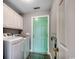 Well-equipped laundry room with mint accents offers washer and dryer at 303 Ayrie Ct., Conway, SC 29527