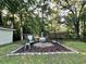 Secluded backyard featuring an outdoor fire pit and comfortable patio seating at 3048 Dewberry Dr., Conway, SC 29527