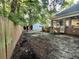 Spacious backyard featuring a detached garage, brick details, and a wooden privacy fence, perfect for outdoor activities at 3048 Dewberry Dr., Conway, SC 29527