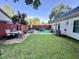 Large backyard with a hot tub, patio furniture, green lawn, and a privacy fence at 3048 Dewberry Dr., Conway, SC 29527