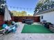 Enjoy the backyard with a hot tub, patio furniture, and an outdoor umbrella at 3048 Dewberry Dr., Conway, SC 29527
