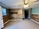 Finished basement with wood-paneled accent wall, offering potential as a rec room or additional living space at 3048 Dewberry Dr., Conway, SC 29527