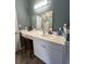 Bathroom featuring a large vanity area, a chair, and white cabinets at 3048 Dewberry Dr., Conway, SC 29527
