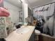 Bathroom with marble-top vanity, and a whimsical shower curtain featuring a highland cow at 3048 Dewberry Dr., Conway, SC 29527