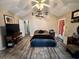 Spacious bedroom with a vaulted ceiling, ceiling fan, and wood-look floors at 3048 Dewberry Dr., Conway, SC 29527