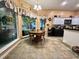 Eat-in kitchen featuring white cabinets, black appliances and large window view at 3048 Dewberry Dr., Conway, SC 29527