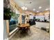 Eat-in kitchen featuring white cabinets, black appliances and large window view at 3048 Dewberry Dr., Conway, SC 29527