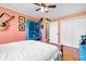 Bright bedroom featuring a blue painted dresser and white closet doors at 308 Old Stage Rd., Mullins, SC 29574