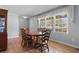 Bright dining room with hardwood floors, large windows, and classic wood furniture at 308 Old Stage Rd., Mullins, SC 29574