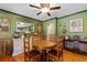 Cozy dining room featuring hardwood floors, textured walls, and a vintage-style ceiling fan at 308 Old Stage Rd., Mullins, SC 29574