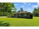 Charming brick home with a well-manicured lawn and inviting front porch at 308 Old Stage Rd., Mullins, SC 29574