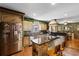 Well-appointed kitchen featuring custom cabinetry, a center island, and stainless steel appliances at 308 Old Stage Rd., Mullins, SC 29574