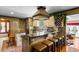 Charming kitchen with a center island, custom hood, and unique rustic finishes at 308 Old Stage Rd., Mullins, SC 29574