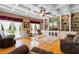 Spacious living room featuring coffered ceiling, hardwood floors, built-in shelving and french doors at 308 Old Stage Rd., Mullins, SC 29574