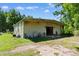 Large metal outbuilding for storage or hobbies with plenty of yard space at 308 Old Stage Rd., Mullins, SC 29574