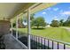 Covered porch with black railing and a view of the front yard at 308 Old Stage Rd., Mullins, SC 29574