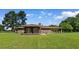Expansive backyard featuring a covered patio, perfect for outdoor entertaining at 308 Old Stage Rd., Mullins, SC 29574