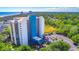 Upscale condo building with plentiful parking and surrounded by trees and wetlands near the ocean at 311 69Th Ave. N # 302, Myrtle Beach, SC 29572