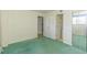View of the room with green carpet leading to closet and doors that show views to other rooms at 311 69Th Ave. N # 302, Myrtle Beach, SC 29572