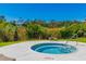 Inviting outdoor hot tub surrounded by lush greenery, offering a relaxing and private retreat at 311 69Th Ave. N # 302, Myrtle Beach, SC 29572