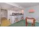 Updated kitchen with stainless steel appliances, sleek countertops, a breakfast bar, and modern stools at 311 69Th Ave. N # 302, Myrtle Beach, SC 29572