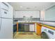 Compact kitchen with stainless steel appliances, wooden countertops, and a patterned backsplash for visual interest at 311 69Th Ave. N # 302, Myrtle Beach, SC 29572